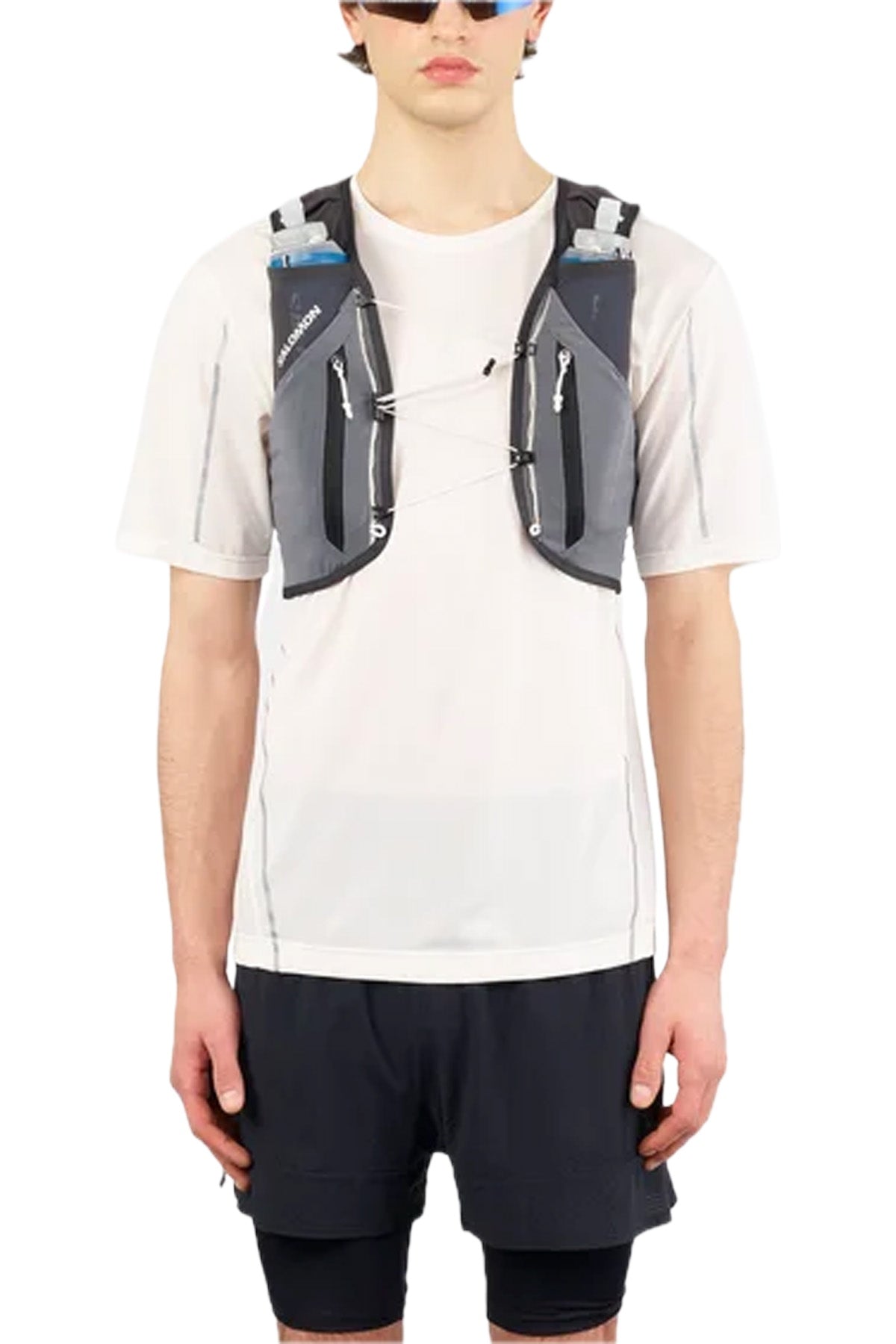 Salomon Adv Skin 12 in grey – worn by a runner, front view
