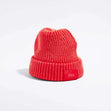 Våga Midweight Beanie in orange-red – angled front view with Våga label