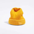 Våga Midweight Beanie in yellow – angled front view with Våga label