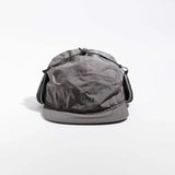 Vaga Padded Hiker Cap in Grau – Vorderansicht mit hochgeklappten, fixierten Ohrenklappen